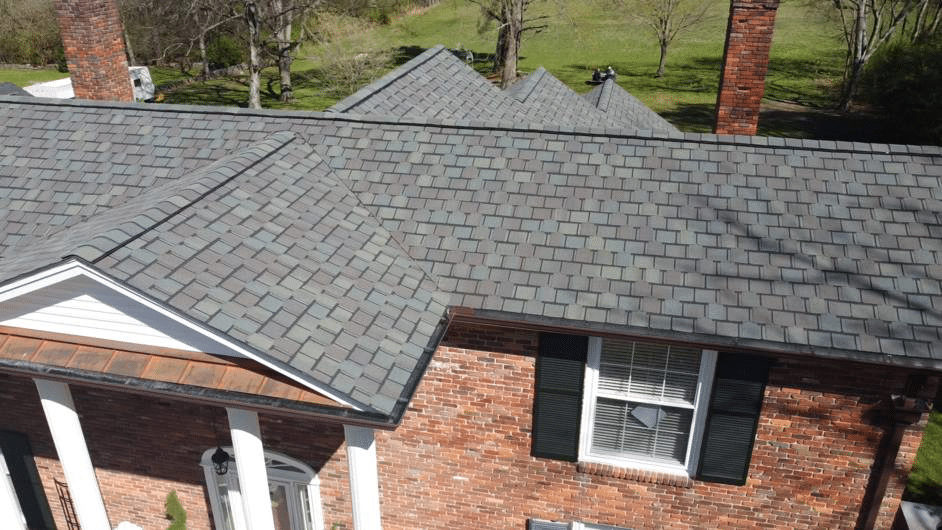 A house with a roof that has been covered in shingles.