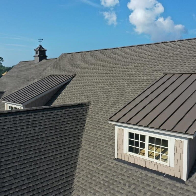 A roof with some windows and a metal roof